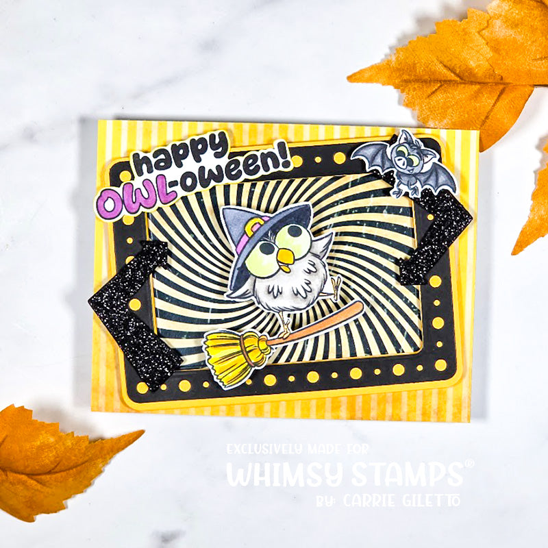 A handmade Halloween card with a yellow-and-black neon light sign border and glitter arrows, featuring a cartoon owl wearing a witch hat and broom, a bat, and the text 'Happy Owl-oween!'.