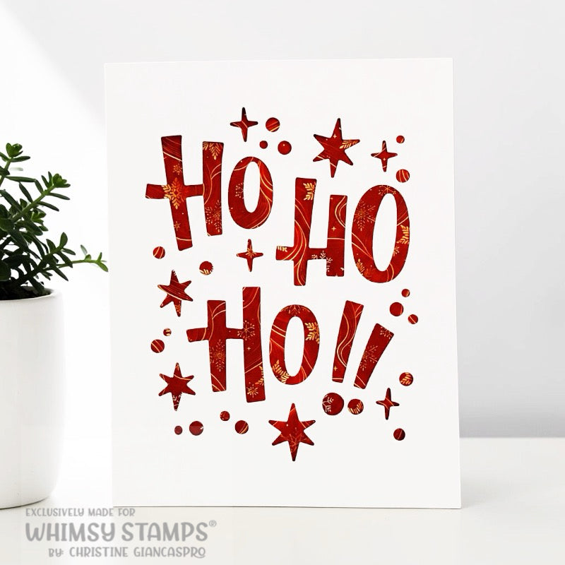 A white greeting card featuring the phrase 'Ho Ho Ho!' die cut in white paper and then layered over a red and gold papered paper.