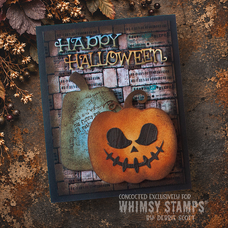 A handmade Halloween card featuring a carved orange pumpkin and a weathered grey pumpkin with die-cut 'Happy Halloween' lettering over a vintage background.