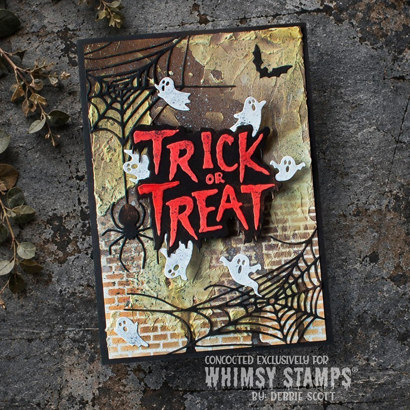 A Halloween card with the words “TRICK OR TREAT” in large red letters, surrounded by black spiderwebs, white ghosts, a spider, a bat, and a vintage, textured brick background.