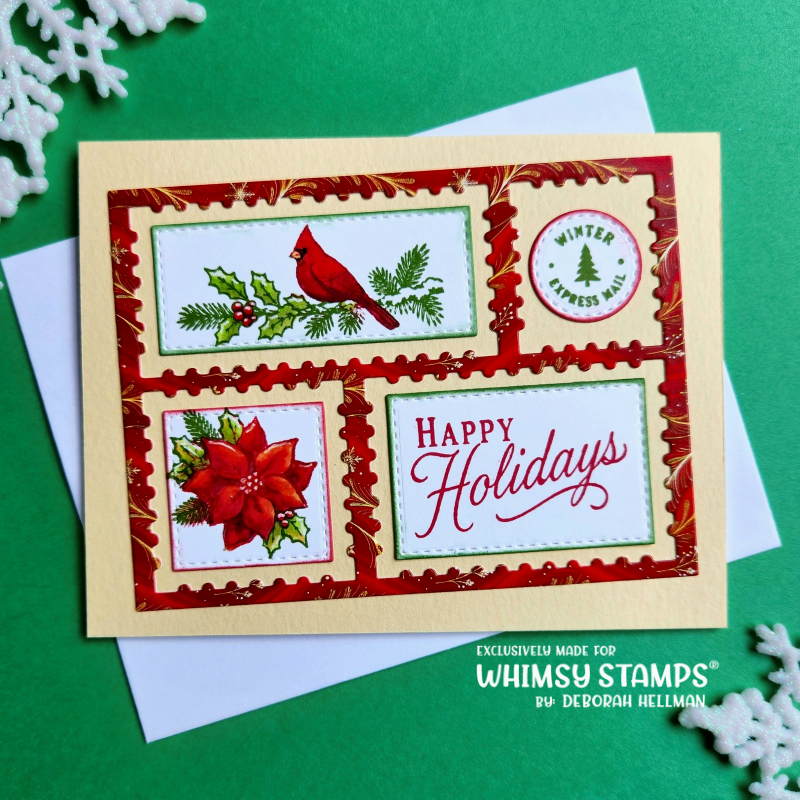A handmade holiday greeting card with a cream border and red decorative postage frame, featuring a red cardinal on holly, a red poinsettia, and 'Happy Holidays' script. 