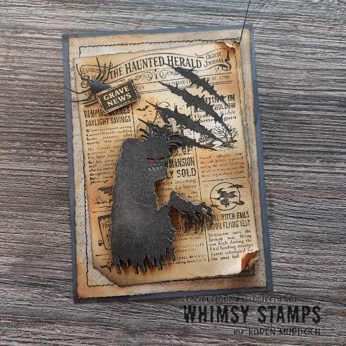 A handmade Halloween card featuring a dark zombie silhouette layered over a vintage newspaper background with spider and scratch-mark cutouts. 