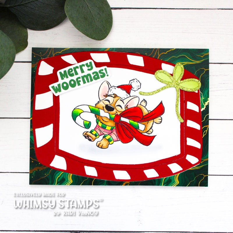 A handmade Christmas greeting card featuring a cartoon dog with a candy cane in his mouth running to wish a 'Merry Woofmas!' 