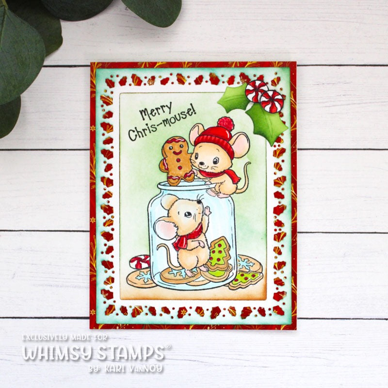 A rectangular holiday greeting card featuring two cartoon mice inside a glass jar with cookies, surrounded by a red holly leaf die cut patterned frame and green holly leaves as accents. Sentiment reads Merry Chris-mouse!