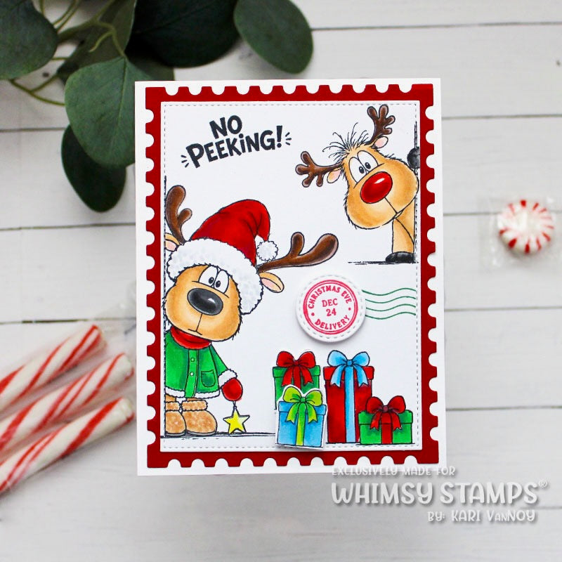 A handmade Christmas greeting card with a red postage edge border, featuring cartoon reindeer, candy canes, wrapped gifts, and the text 'NO PEEKING!'. 
