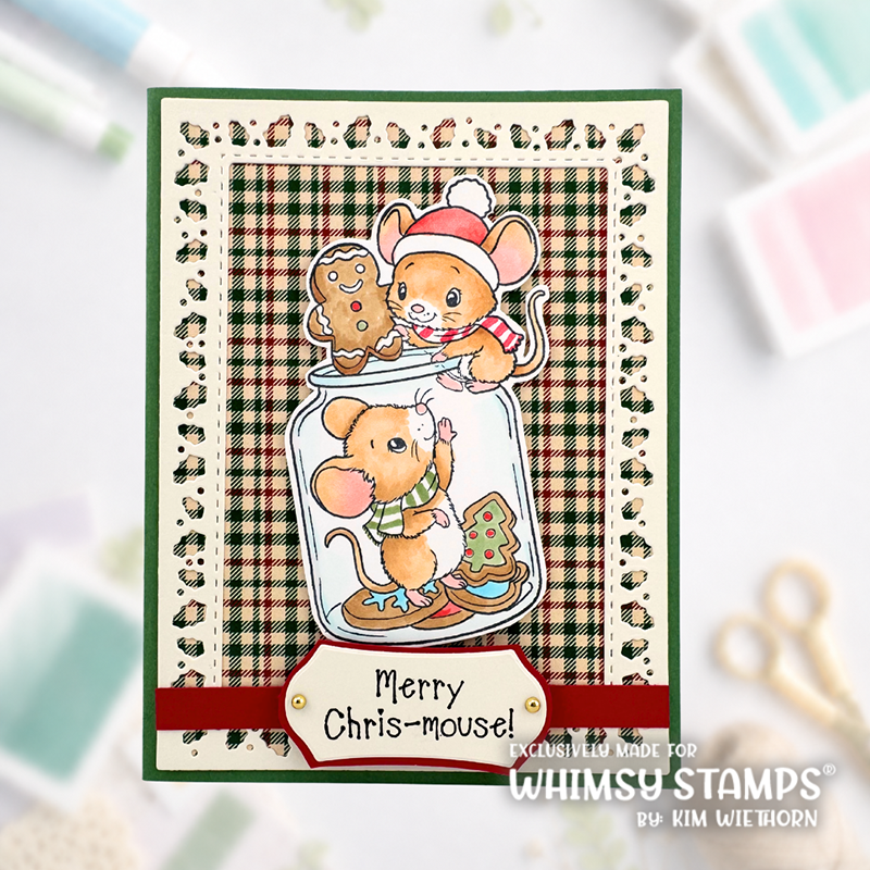 A handmade Christmas greeting card featuring two cartoon mice in a glass jar with gingerbread cookies, set against a green, beige, and tan plaid background. The card has a red ribbon banner at the bottom that reads 'Merry Chris-mouse!'.