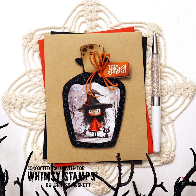A handmade Halloween card featuring a witch character in a black hat and red dress inside a glittery black potion bottle with an orange 'Yikes!' tag.