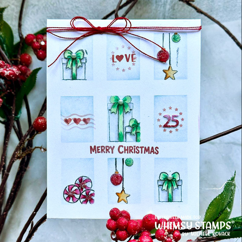 A handmade Christmas greeting card with a white cardstock base, decorated with watercolor gift boxes in blue, red, and green, a red twine bow at the top, and 'MERRY CHRISTMAS' written in red. 